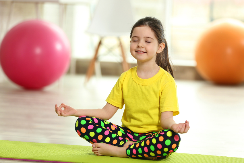Child in a yoga pose